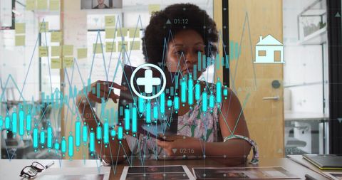 Businesswoman Analyzing Financial Charts with Futuristic Technology