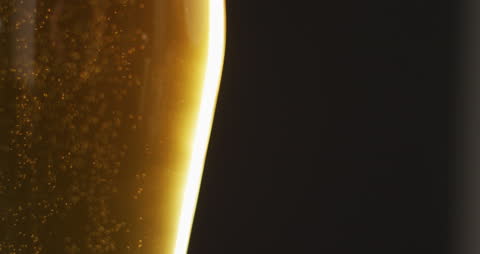 Close-Up of Luminous Beer with Effervescence