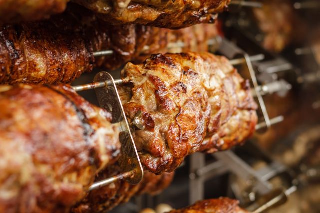 Close-Up of Grilled Pork Rotisserie With Crispy Skin - Download Free Stock Photos Pikwizard.com