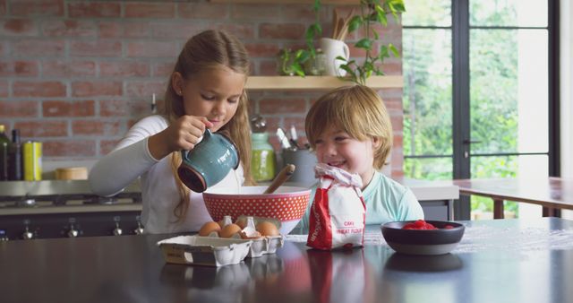 Smiling Siblings Baking Together in Modern Kitchen - Download Free Stock Images Pikwizard.com