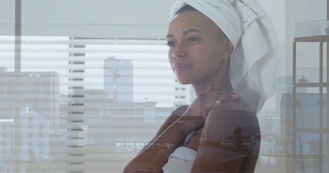 Woman with Towel in Cityscape Reflection Celebrating Self Care
