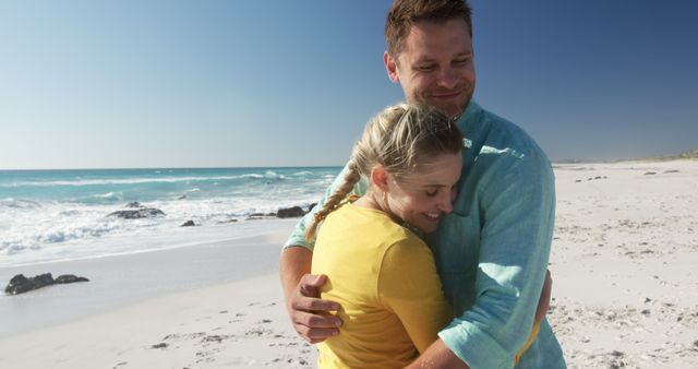 Happy Couple Embracing on Sunny Beach Coastline - Download Free Stock Images Pikwizard.com