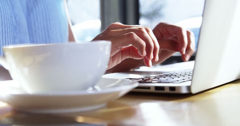 Woman Typing on Laptop in Bright Cafe Setting - Download Free Stock Images Pikwizard.com