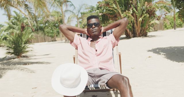 Relaxed Man Sunbathing on Tropical Beach Chair - Download Free Stock Images Pikwizard.com