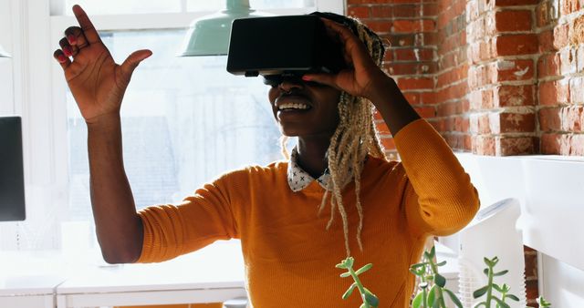 Woman Using VR Headset Exploring Virtual Reality in Modern Home - Download Free Stock Images Pikwizard.com