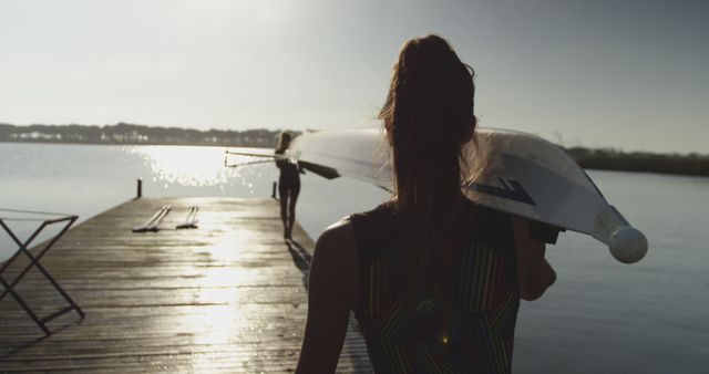 Female Rowers Carrying Racing Shell To Water At Sunrise - Download Free Stock Images Pikwizard.com