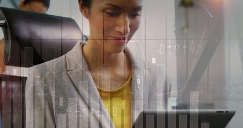 Caucasian Businesswoman Utilizing Data Visualization on Tablet