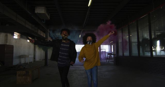 Young Couple Celebrating with Smoke Bombs in Grungy Urban Space - Download Free Stock Images Pikwizard.com