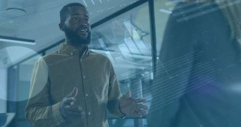 Diverse business team analysing data in modern office