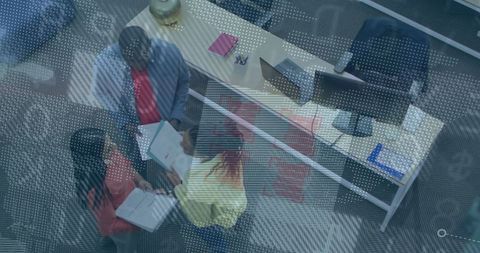 Corporate Team Reviewing Reports in Modern Office