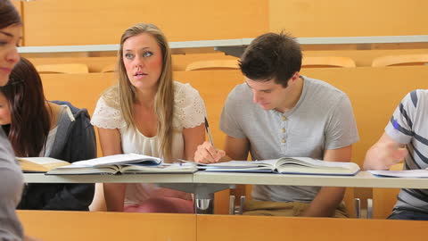 Student Using Smartphone During Lecture in University