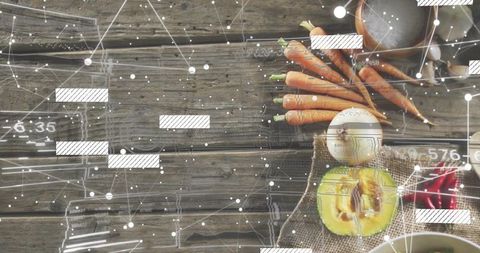 Displaying rustic flatlay with carrots, halved avocado, egg and burlap on weathered wood