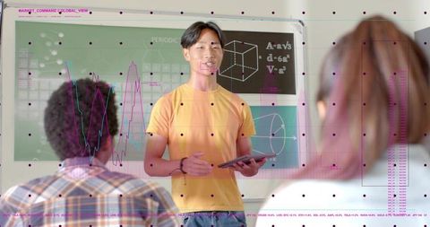 Teen Presenting STEM Project with Tablet in Classroom Showing Geometry and Data Visuals