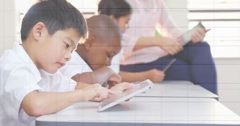 Children Using Tablets in Classroom for Interactive Learning
