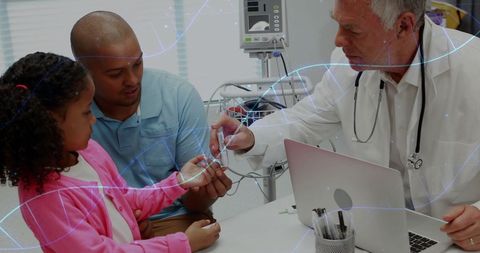 Doctor explaining dna concept to young patient and father in hospital