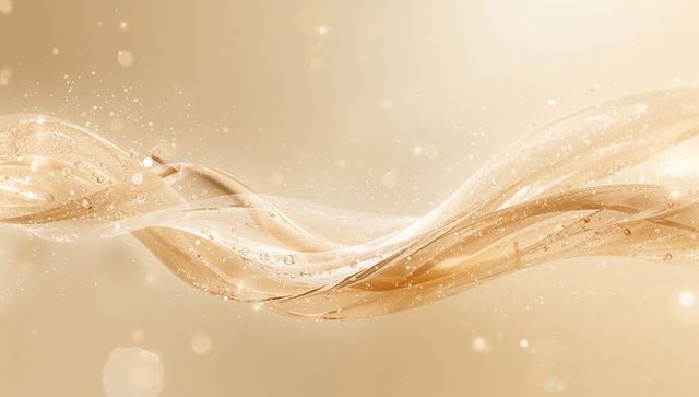 Gliding translucent golden ribbon flowing across beige backdrop with bokeh and soft glow