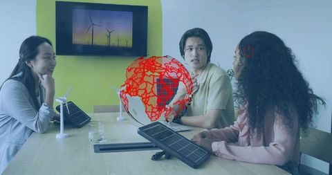 Team discussing wind energy solutions with futuristic globe graphic