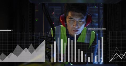 Asian Technician Analyzing Data in a Server Room - Download Free Stock Images Pikwizard.com
