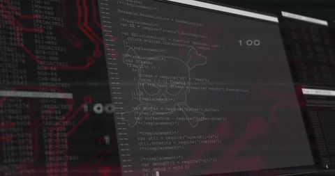 Vertical monitor showing source code with skull overlay and red PCB circuitry