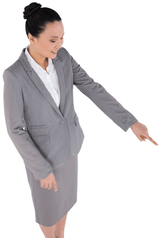 Transparent businesswoman smiling and pointing in gray suit