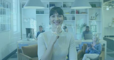 Businesswoman With Futuristic Infographics and Colleagues in Background