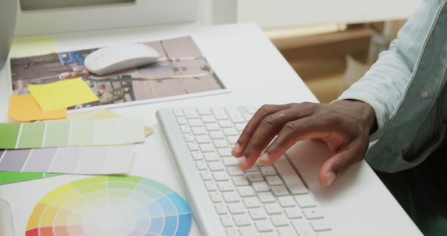 Black Designer Working on Computer Keyboard with Color Samples on Desk - Download Free Stock Images Pikwizard.com