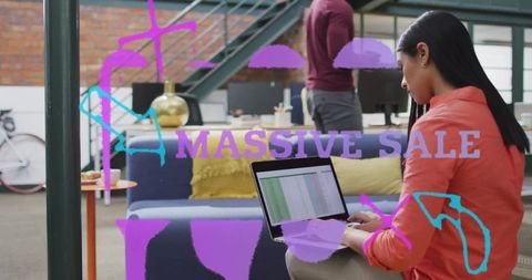 Asian Woman Typing on Laptop in Modern Loft Office Workspace