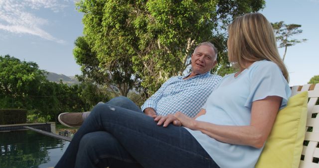 Senior Couple Relaxing by Pool and Enjoying Conversation - Download Free Stock Images Pikwizard.com