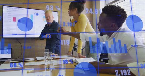 Business Team Evaluating Data Analytics with Digital Visualization