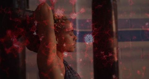 Athletic woman stretching in gym with red fractal overlay, focusing on strength, health