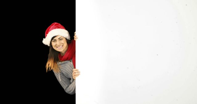 Smiling Woman in Santa Hat Peeking Around White Board - Download Free Stock Images Pikwizard.com