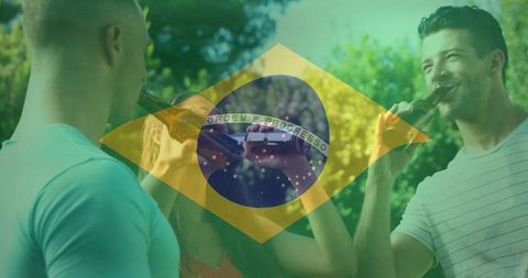 Friends Celebrating with Beer Under Brazilian Flag