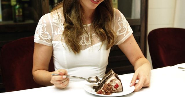 Pretty girl eating chocolate cake