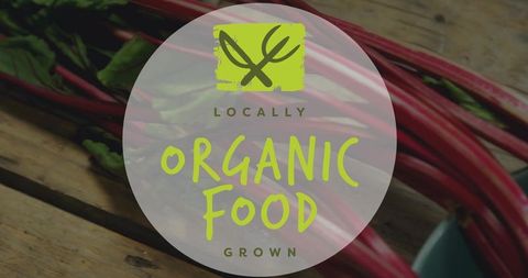 Locally grown organic food label on rustic wood with red swiss chard and teal bowl