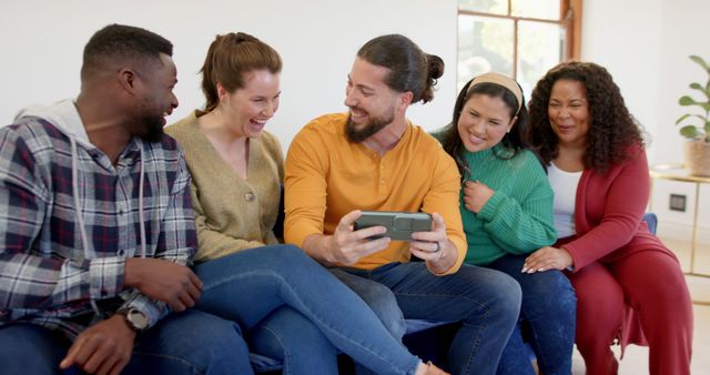 Diverse Friends Relaxing on Sofa Watching Something Together - Download Free Stock Images Pikwizard.com