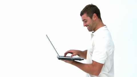 Smiling Man Using Laptop on White Background