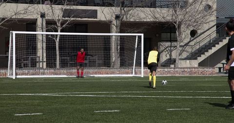 Soccer Players Ready for Penalty Kick on Outdoor Field