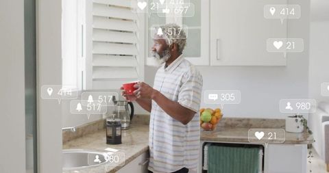 Man Engaging With Digital Notifications in Kitchen Environment