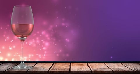 Elegant Wine Glass with Rosé and Glowing Lights Background