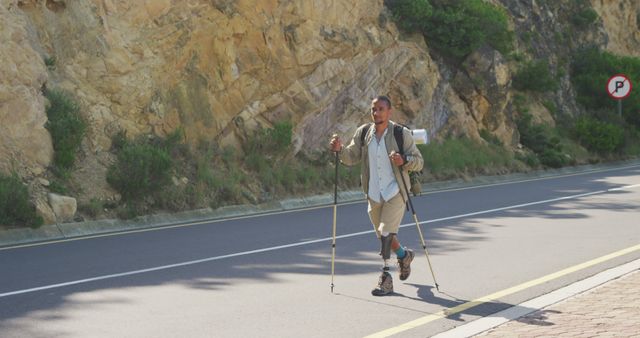 Determined Amputee Man Hiking on Mountain Road - Download Free Stock Images Pikwizard.com