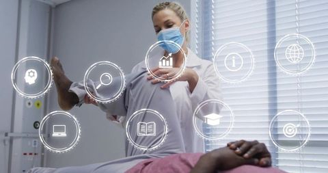 Clinician performing physical therapy with digital holographic icons for rehab technology