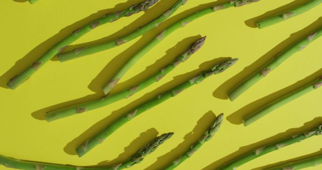 Green Asparagus Spears on Vibrant Yellow Background - Download Free Stock Images Pikwizard.com
