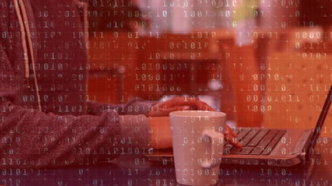 Student Typing on Laptop with Digital Data Overlay