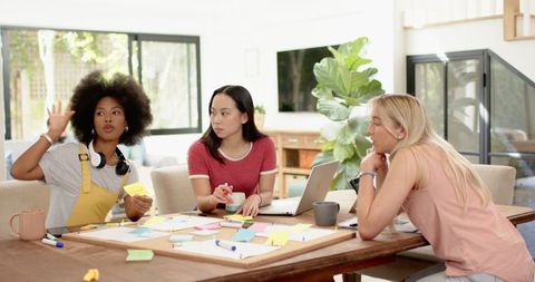 Diverse female team engaged in creative brainstorming session