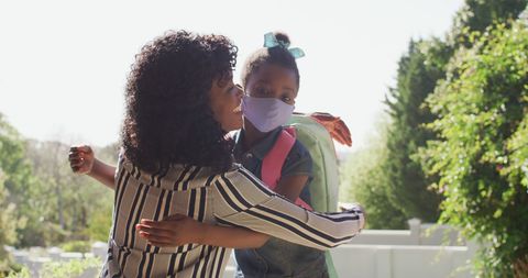 Mother and Daughter Embracing Outdoors on Sunny Day - Download Free Stock Images Pikwizard.com