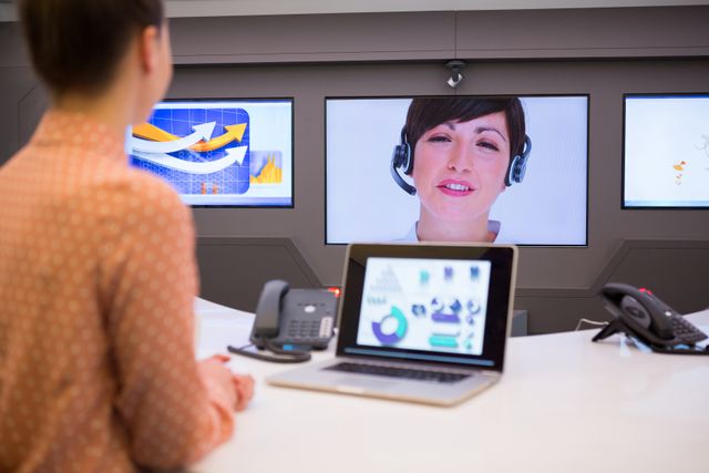 Female executive having video call in boardroom of office