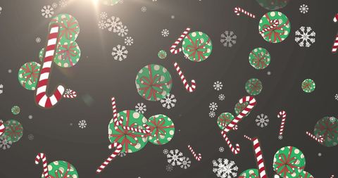 Floating christmas candies and snowflakes on glowing grey background