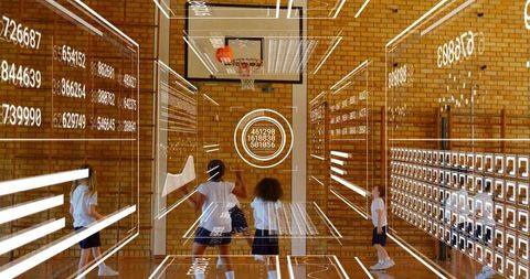 School students playing basketball with augmented reality hud overlays and data analytics