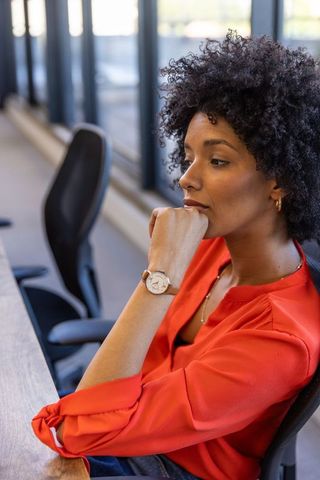 Contemplative professional in modern office environment