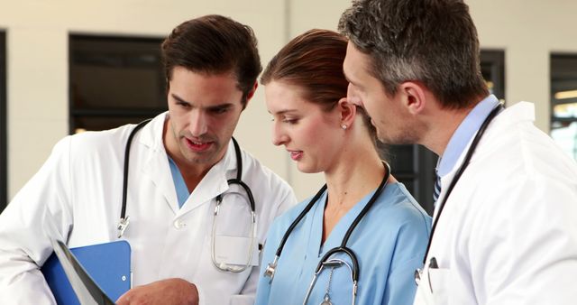 Healthcare Professionals Discussing Medical Records in Hospital - Download Free Stock Images Pikwizard.com